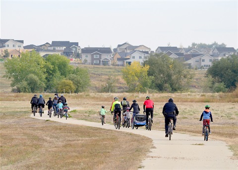 People walking and biking on the Weld Legacy Trail