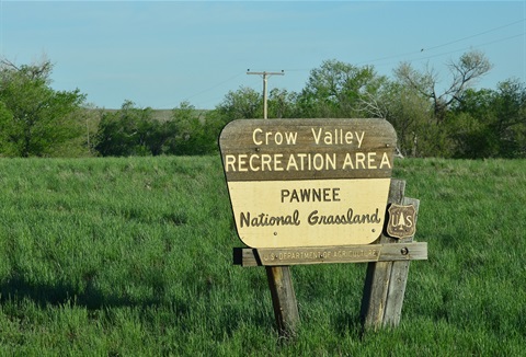 A sign welcoming people to Crow Valley Campground in Briggsdale